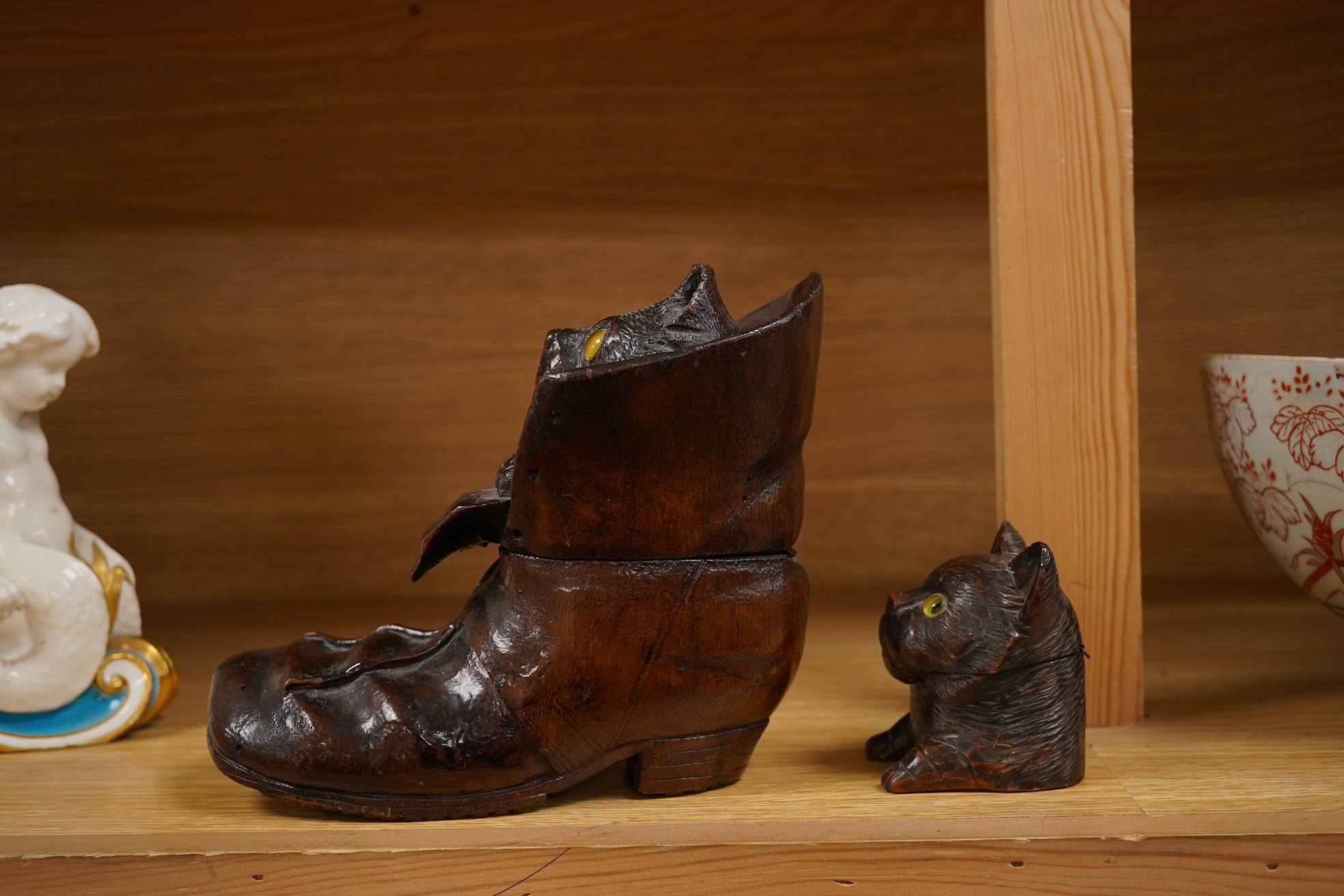 A Black Forest carving of a kitten in a boot inkwell and another car inkwell, tallest 15cm